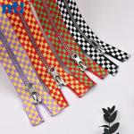 #5 Brass zipper with embossed ribbon