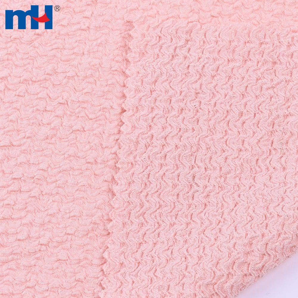 Tissu crêpe tweed rose, 95% polyester 5% spandex