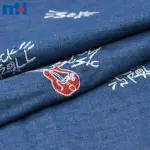 Gitar işlemeli denim kumaş