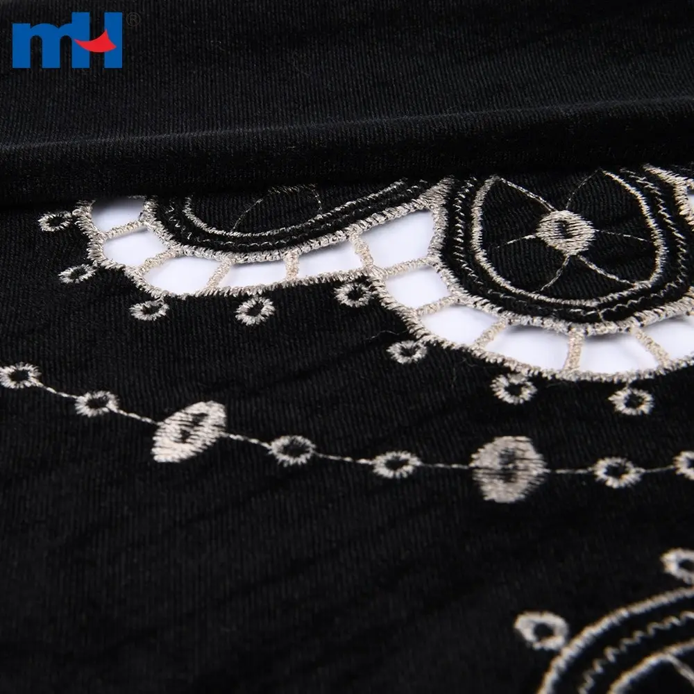 Embroidery on fabric by laser cutting