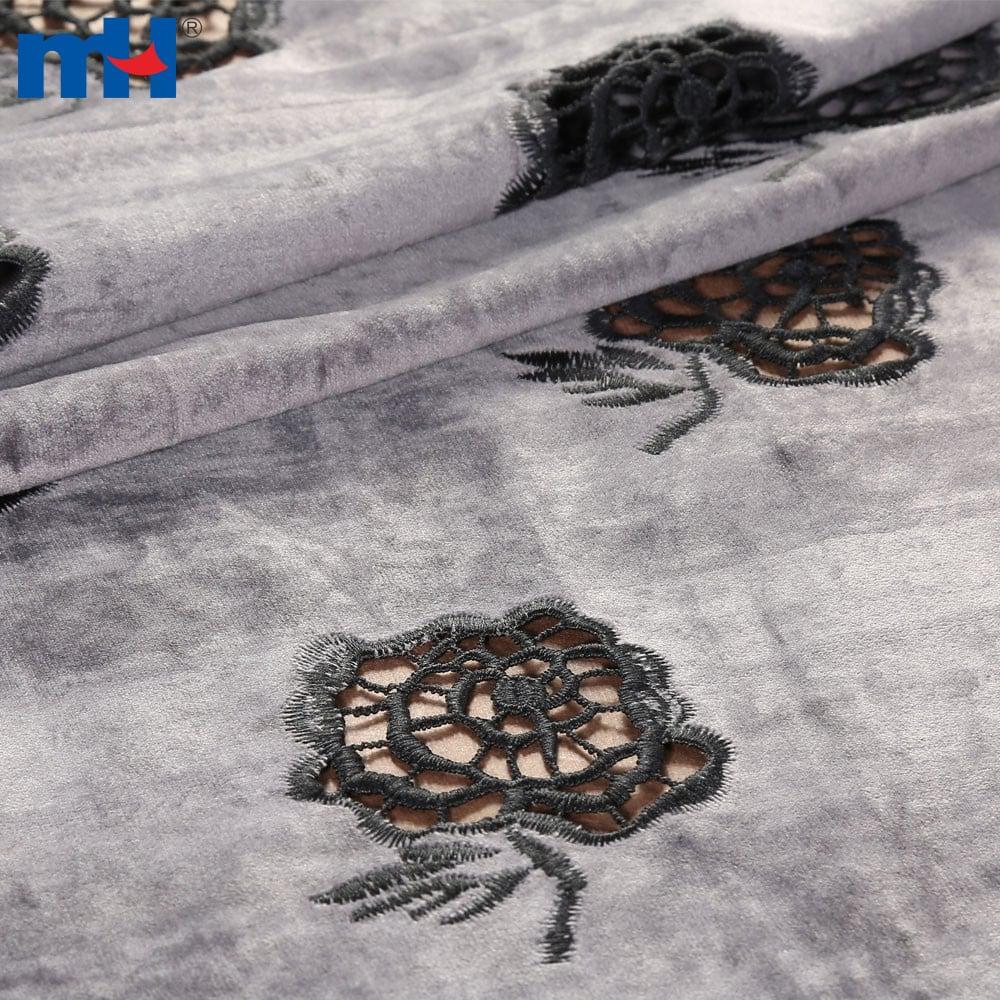 Embroidery on fabric by laser cutting