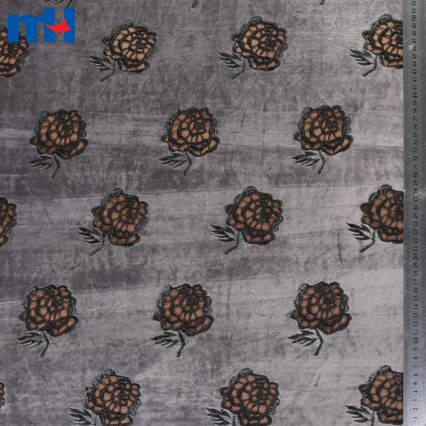 Embroidery on fabric by laser cutting