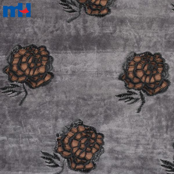 Embroidery on fabric by laser cutting