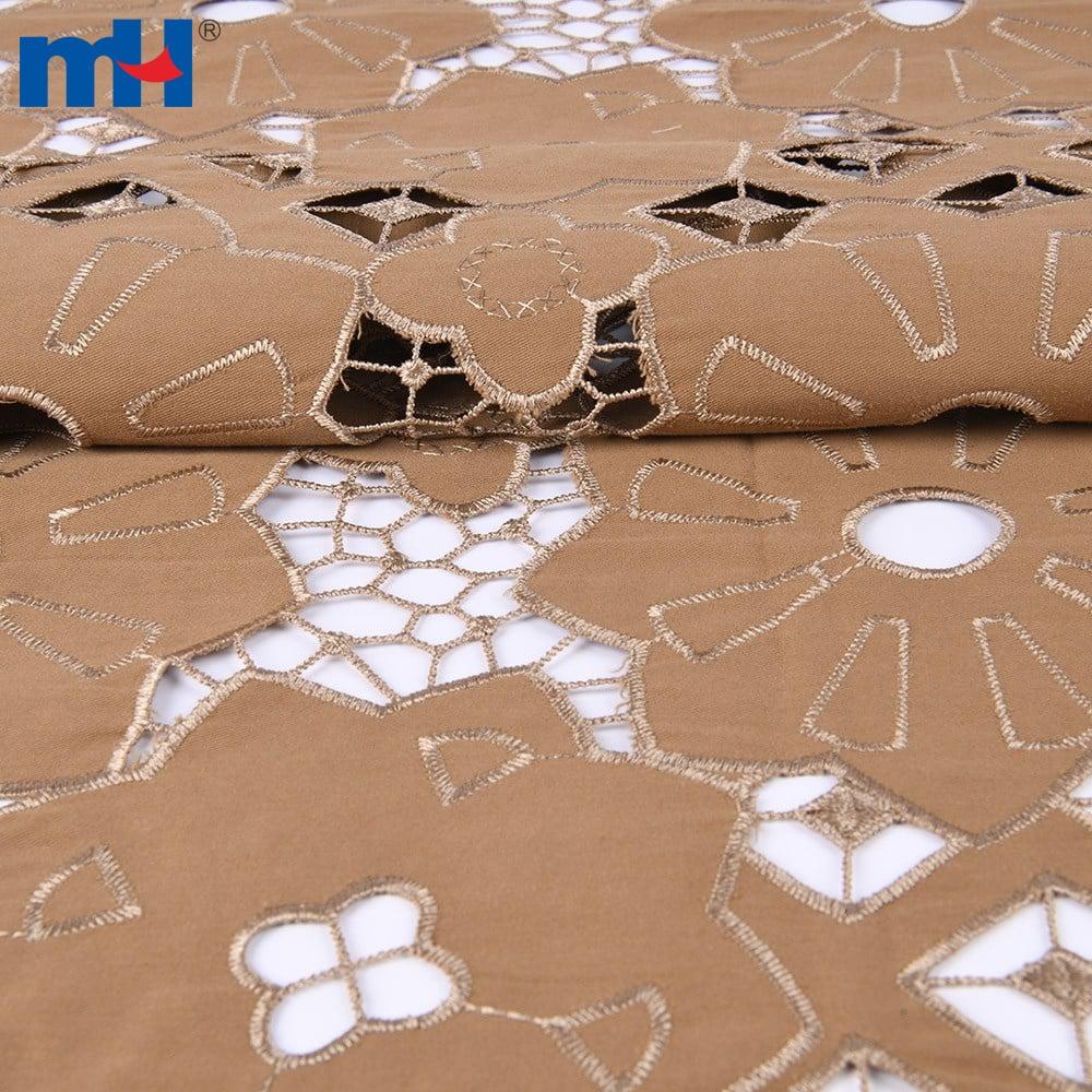 Broderie sur tissu par découpe laser