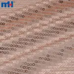 Tissu en maille à paillettes or rose