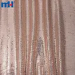 Tissu en maille à paillettes or rose