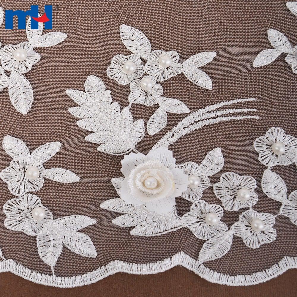 Diseñar un vestido de novia hecho de encaje y abalorios