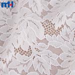 Tissu dentelle extensible - motif floral élégant