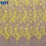 Yellow embroidered organza fabric